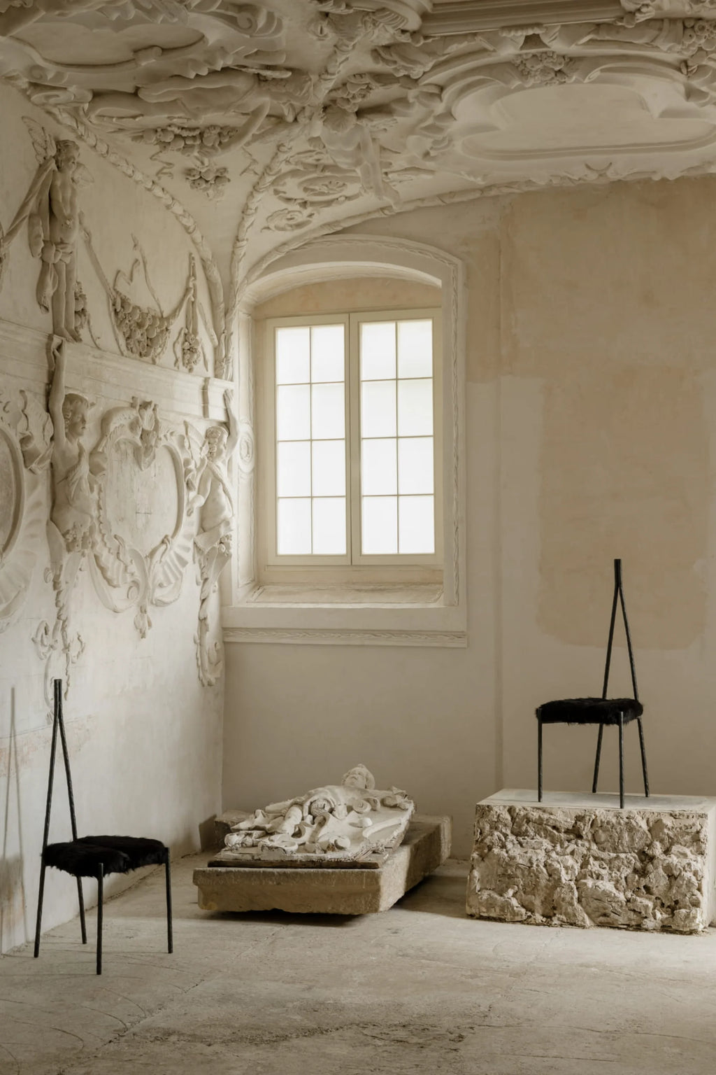 NG DESIGN Object 117 Chair, a modern black metal chair with a fluffy black seat, displayed in a rustic room. Perfect accent seating for contemporary spaces.