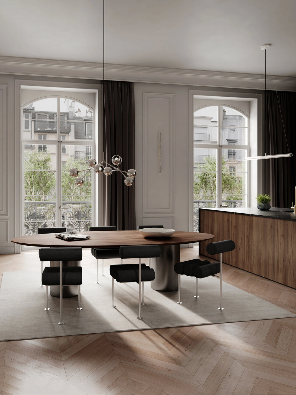 101 CPH Hiro Dining Chair in a modern dining room. The six chairs feature black upholstered seats, cylindrical backrests, and silver-toned metal legs. Shown with a dark wood oval table on a light gray rug. Ideal for contemporary dining spaces.