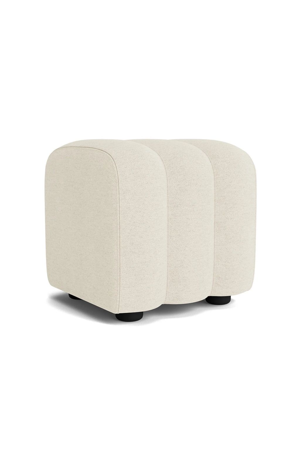 NORR11 Studio Pouf, a cream-colored organic modern pouf upholstered in textured bouclé fabric with a soft, plush feel and a distinctive segmented, rounded rectangular shape. This sculptural accent piece features subtle black feet and is perfect as a contemporary footrest or versatile extra seating for minimalist living rooms and cozy bedrooms.