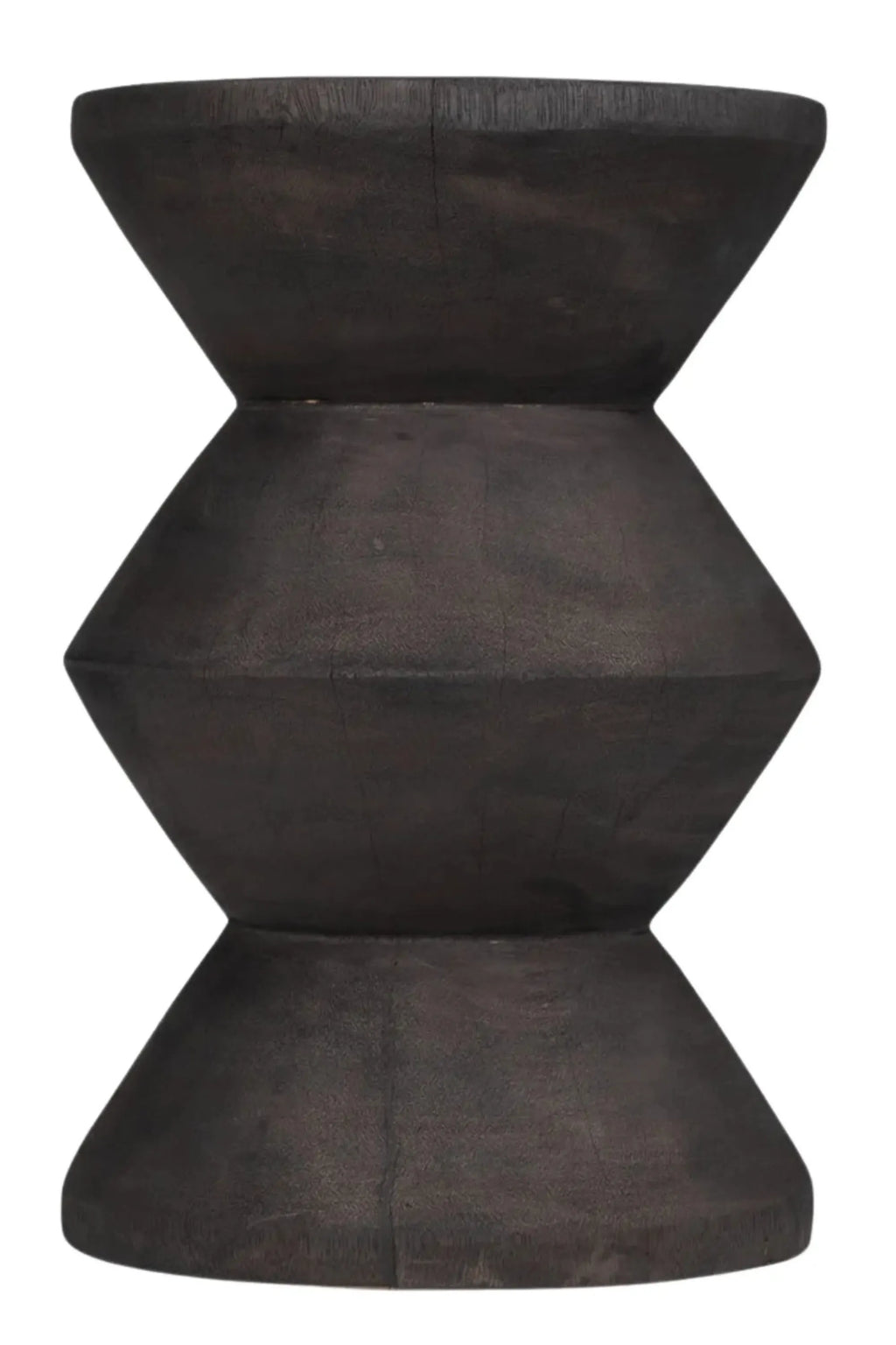 Detjer Stool S.A.S. 003, a dark brown solid wood accent stool with a distinctive hourglass or double cone geometric shape. It features a rich, textured, almost charcoal brown finish that highlights the natural wood grain and rustic imperfections. This sculptural piece is perfect as a brutalist side table, organic modern accent stool, or minimalist decorative element for a living room or bedroom.