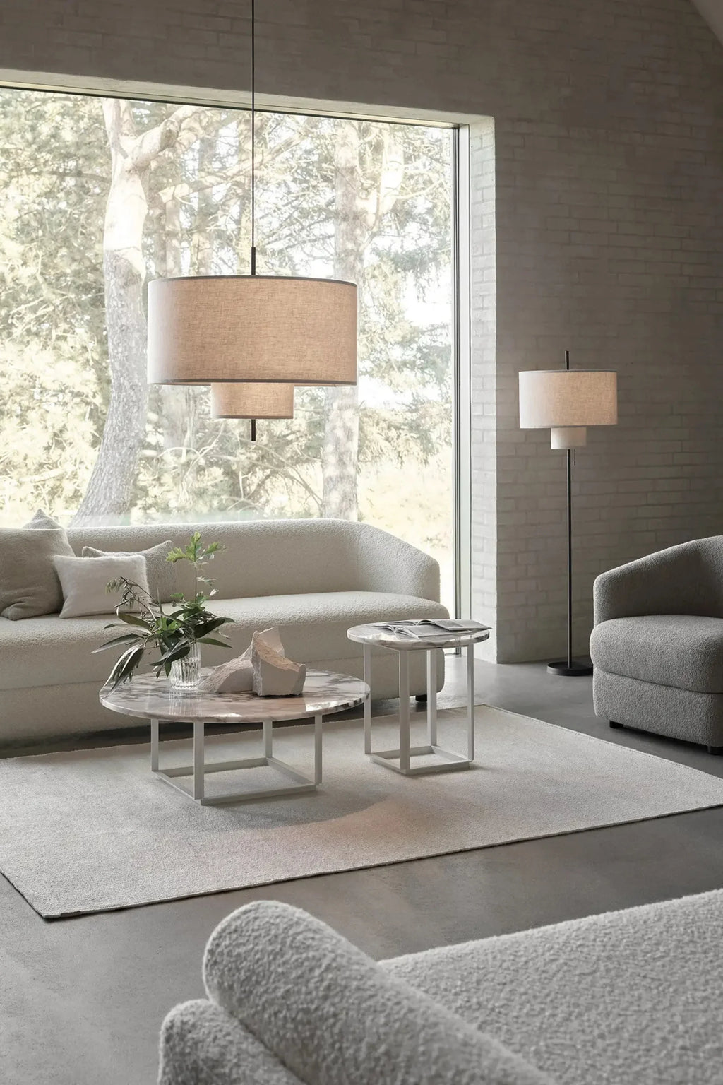 New Works Covent Sofa Deep 3-Seater, a contemporary organic modern sofa upholstered in soft, textured cream bouclé fabric with a gently curved backrest and deep, plush seating. This minimalist 3-seater sofa is perfect for creating a cozy yet sophisticated Scandinavian living room or modern minimalist space.