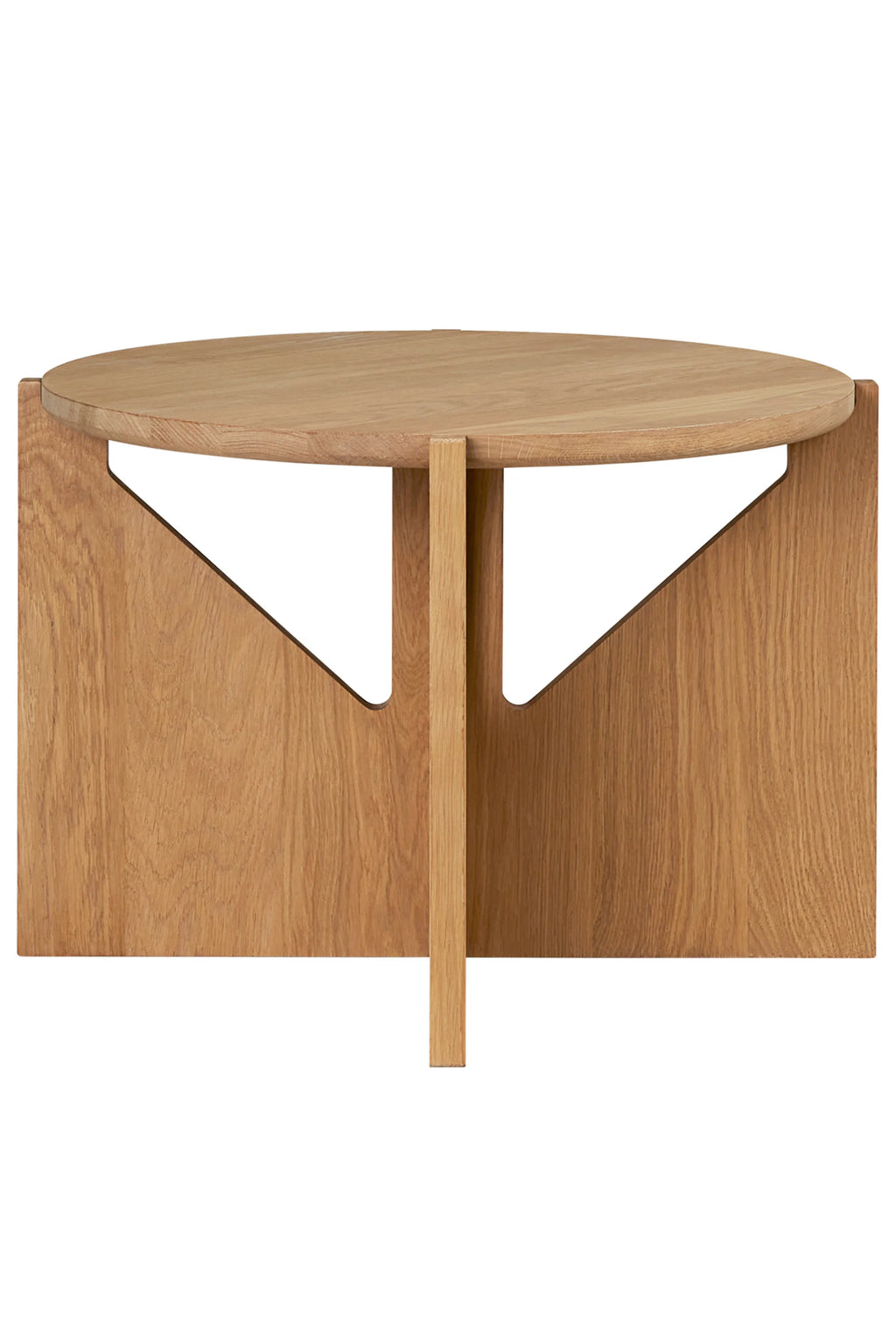 Kristina Dam Simple Coffee Table, a round modern minimalist coffee table crafted from natural solid oak with a smooth, light wood grain finish. Its unique geometric base features triangular cutouts and a central support, creating a sculptural design. Perfect for Scandinavian living rooms or contemporary lounge areas.
