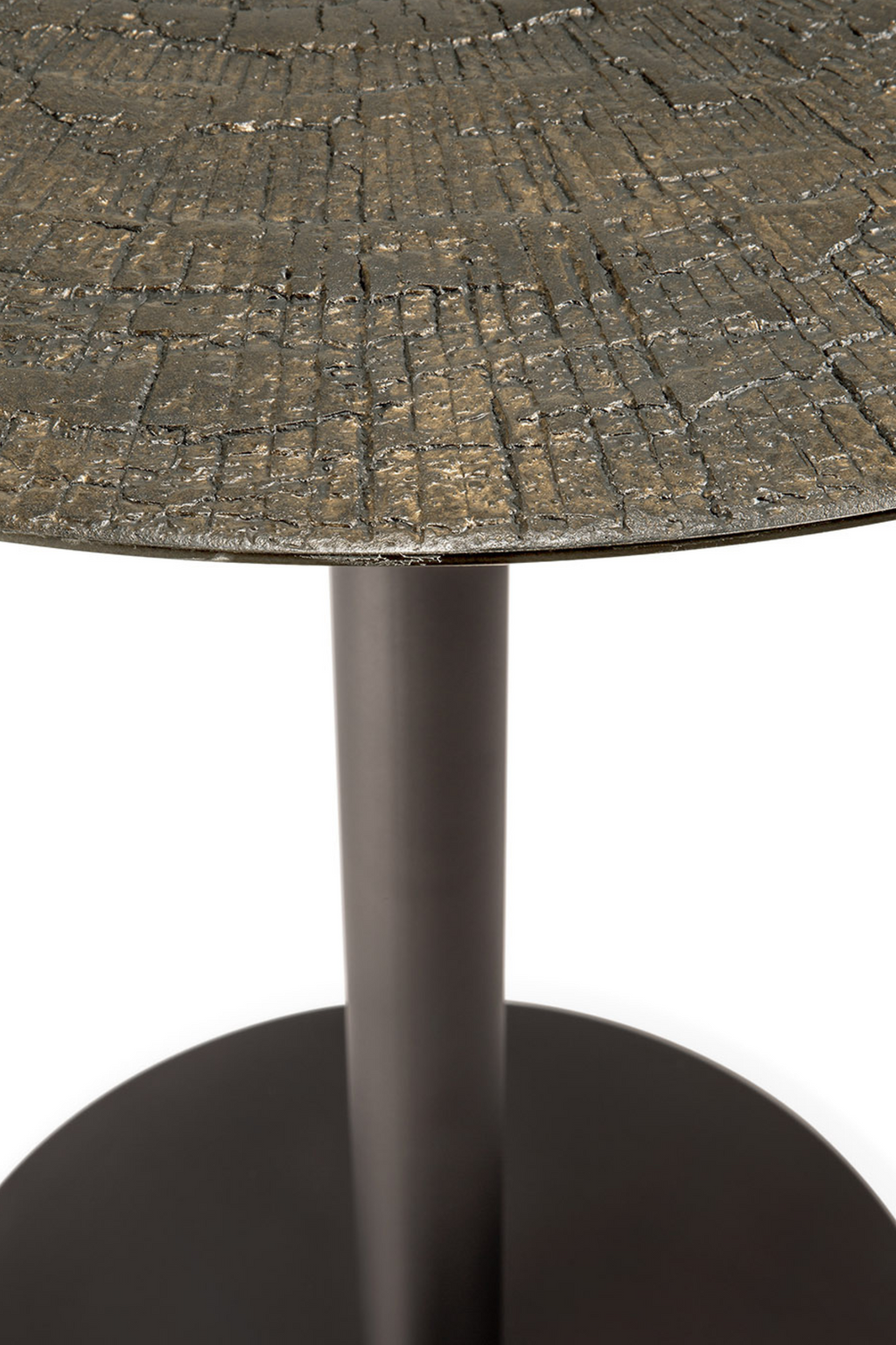 Ethnicraft Blend Round Dining Table, an industrial chic dining table featuring a unique dark bronze-toned cast metal tabletop with a deeply textured, organic bark-like pattern, supported by a sleek matte black metal pedestal base and round foot. This rustic modern dining table is perfect for contemporary dining rooms and sophisticated kitchen spaces seeking a sculptural focal point.