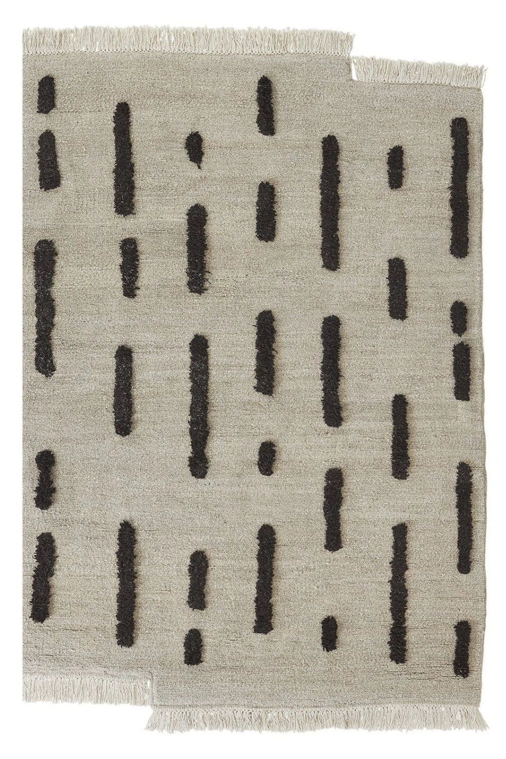 Sera Helsinki Laine Rug, a hand-knotted wool area rug featuring a light natural beige background with an abstract pattern of dark charcoal, irregular, high-low pile lines, and fringed edges. The design has an organic, minimalist aesthetic, with a unique subtly irregular shape on one corner. Ideal as a Scandinavian or japandi rug for modern living rooms, cozy bedrooms, or minimalist home offices.