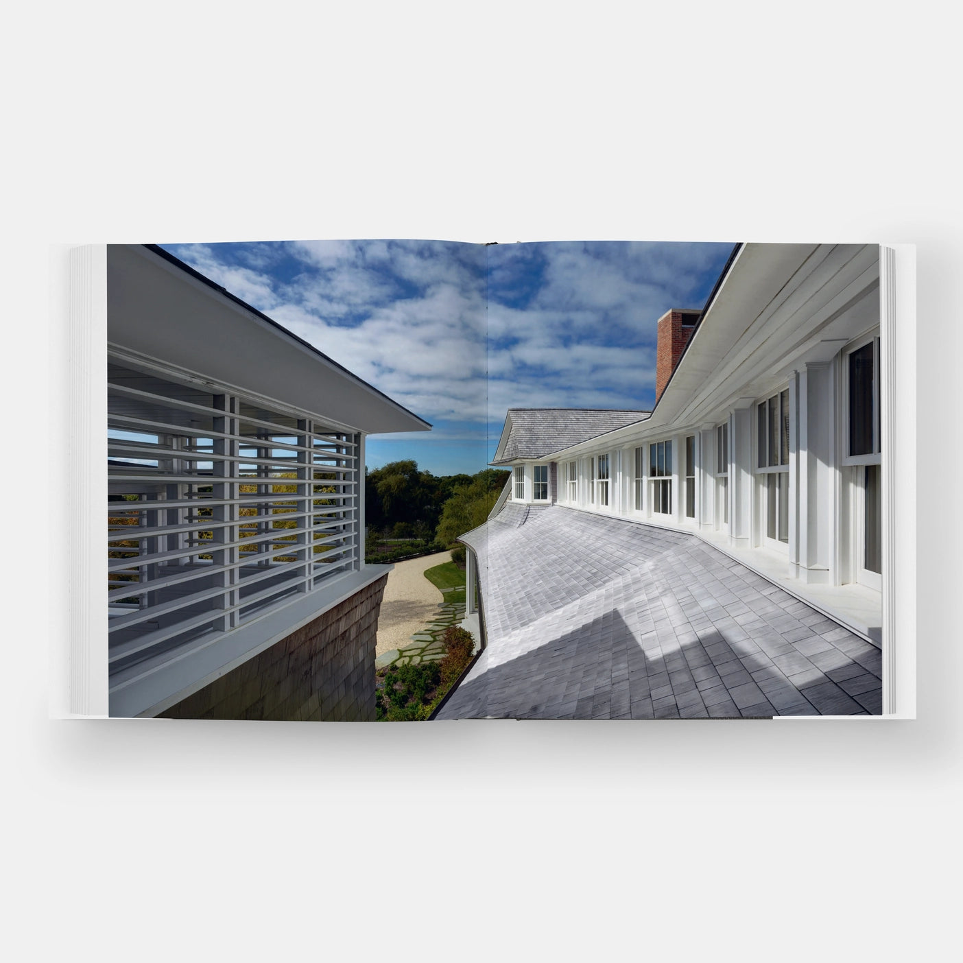 Elegant shingle and stone facade on a commercial building with glass windows