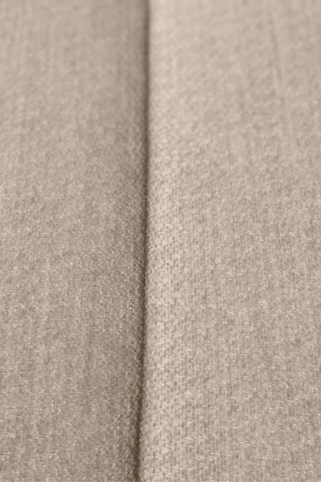 Eichholtz Breva Sofa, featuring a luxurious beige textured woven upholstery fabric with a subtle melange effect and clean tailored seam, offering a sophisticated neutral palette. This contemporary sofa is ideal for creating an organic modern living room or a cozy, upscale lounge space.