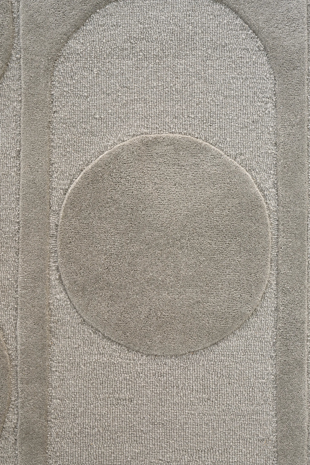 Linie Design Orb Alliance Wool Rug, a modern textured area rug in a neutral greige, featuring a bold geometric pattern of raised circles and elongated ovals in a plush cut pile, contrasted by a lower loop pile background. This contemporary Scandinavian-style wool rug is ideal for adding warmth and visual interest to minimalist living rooms or organic modern bedrooms.