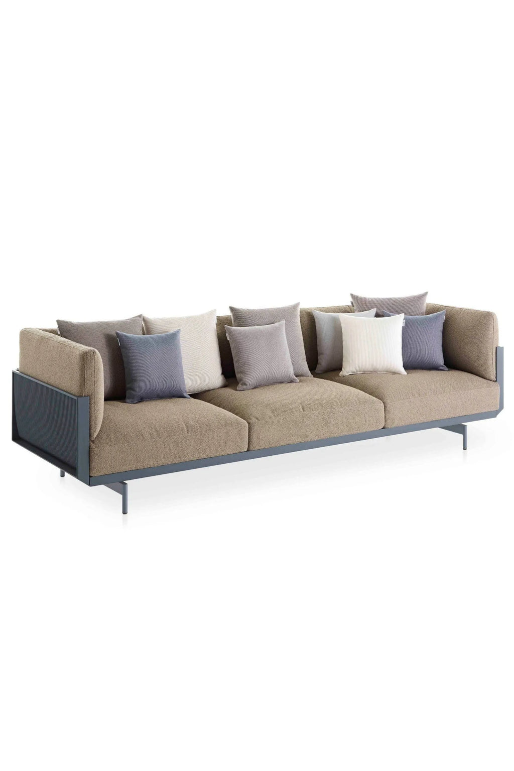 Gandia Blasco Onde 3-seater Sofa, a contemporary outdoor lounge sofa featuring a low-profile matte dark grey powder-coated aluminum frame with elegant slatted side panels and comfortable textured beige outdoor fabric upholstery. This modern minimalist patio sofa includes a variety of decorative cushions in complementary light grey, dark grey, blue-grey, and off-white tones. Ideal for luxurious outdoor living rooms, modern garden lounges, or stylish terrace seating areas.