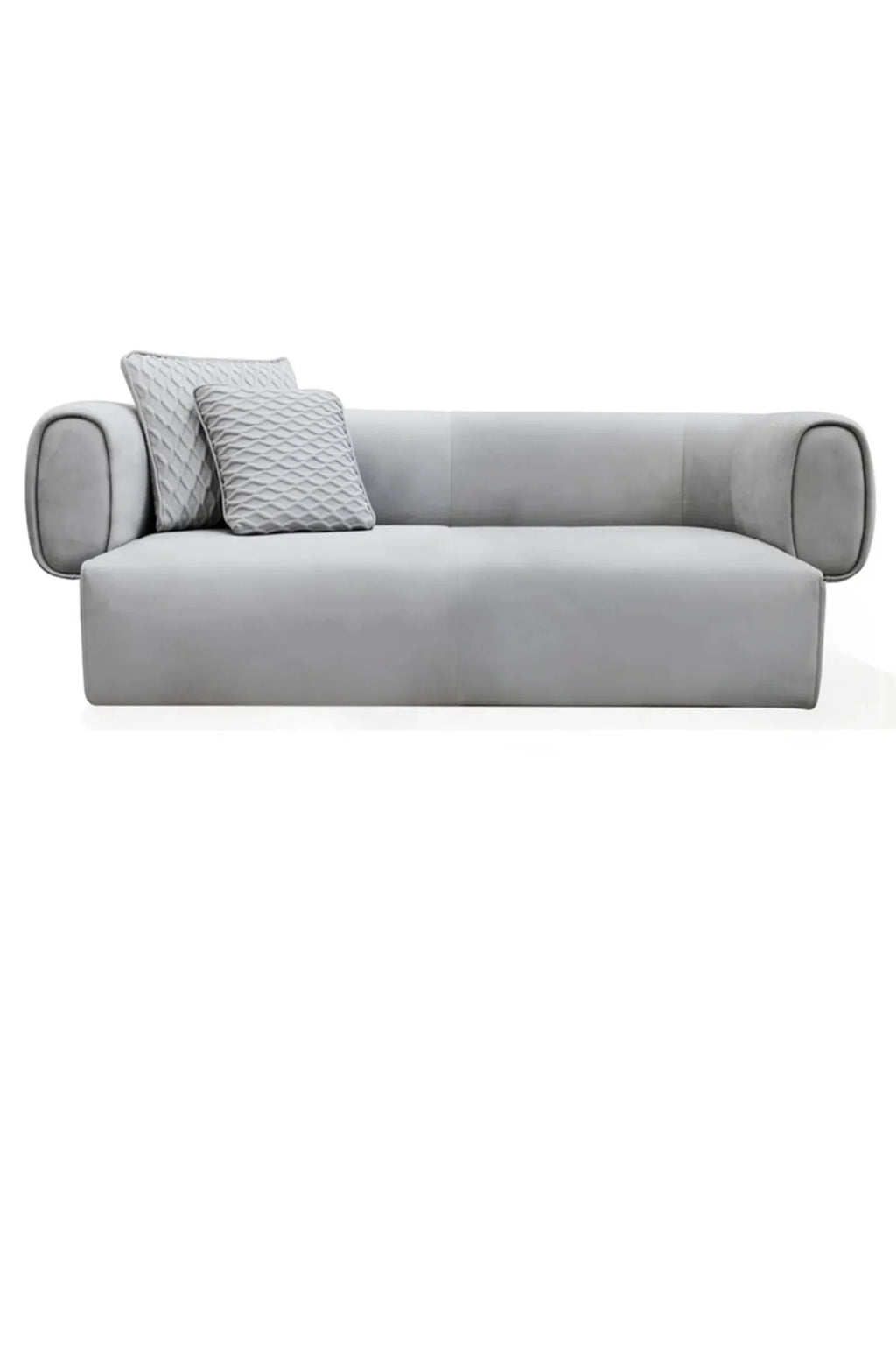 Hessentia Hug Sofa, a sleek modern minimalist sofa upholstered in a soft light grey fabric, featuring distinctive rounded cylindrical arms and a low profile. This contemporary 3-seater couch offers plush comfort and comes with two matching quilted accent pillows for added texture and style. Ideal as a designer living room sofa or a chic focal point in modern minimalist interiors.