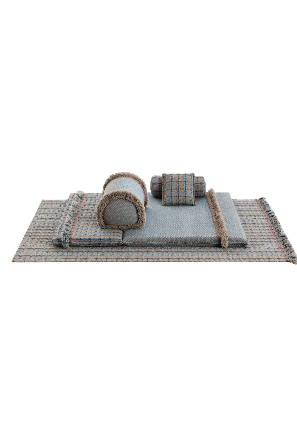 GAN Rugs Garden Layers Composition 06, a modular outdoor sofa and lounge set featuring a large rectangular base mat, a seat cushion, and three decorative cushions, all crafted from a durable woven outdoor.