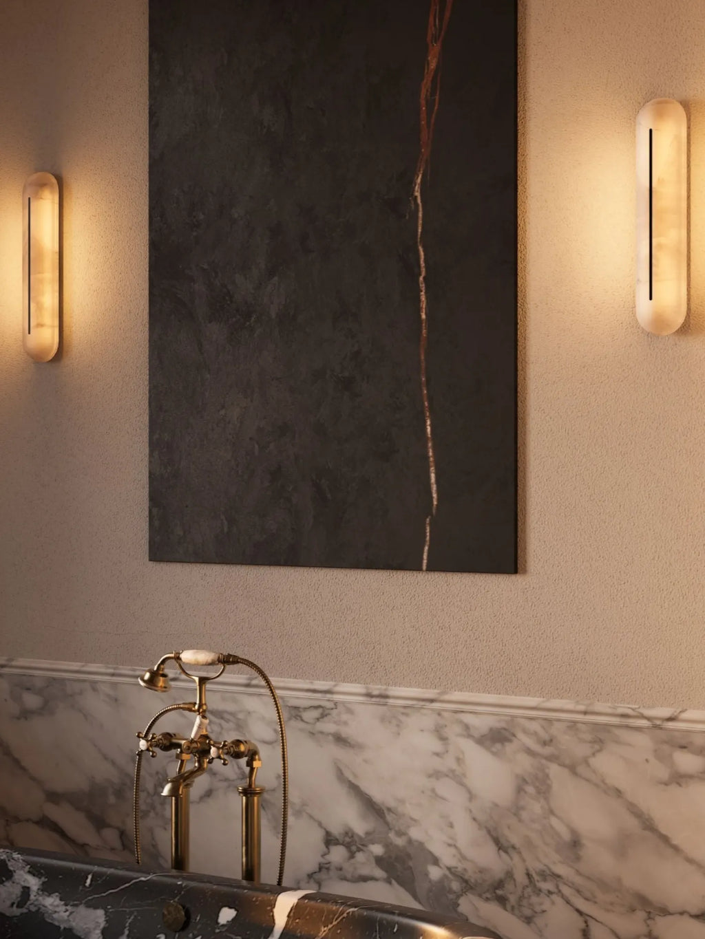 CTO Lighting Hepworth Tall Wall Light, a luxurious modern wall sconce crafted from translucent alabaster stone in an elongated capsule shape, featuring a central black metal slot that emits a warm, ambient glow. This contemporary alabaster wall light is perfect for sophisticated bathroom lighting, bedroom accents, or upscale living room interiors.