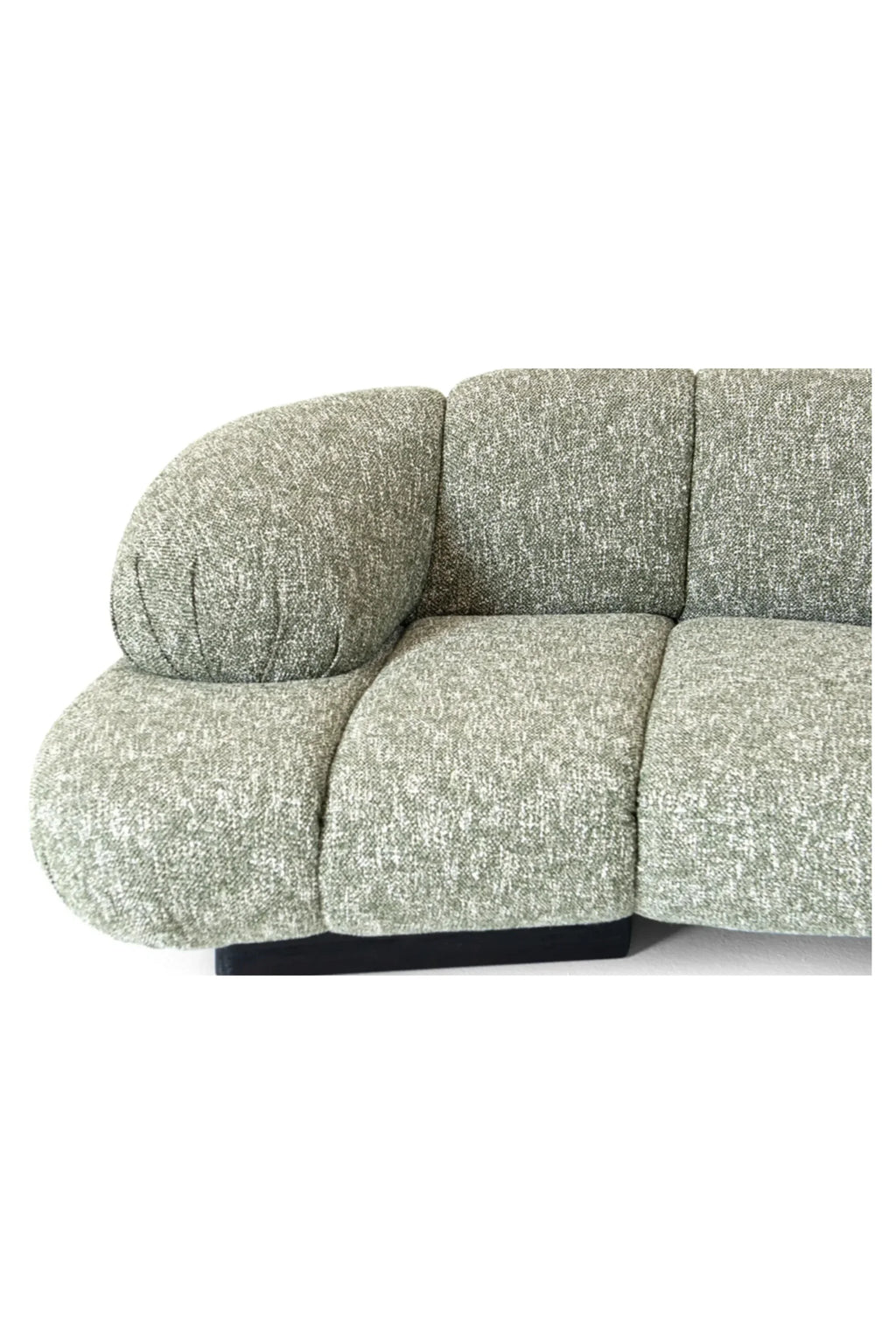 Hessentia Kiro Long Sofa, a contemporary modular sofa upholstered in a heathered sage green textured fabric with a subtle two-tone weave, featuring a distinctive rounded armrest and plush deep seating. Its organic curves and low-profile design, supported by a sleek black base, perfectly blend modern minimalist and organic modern aesthetics. Ideal for a luxurious living room or spacious lounge area seeking a comfortable and stylish statement piece.