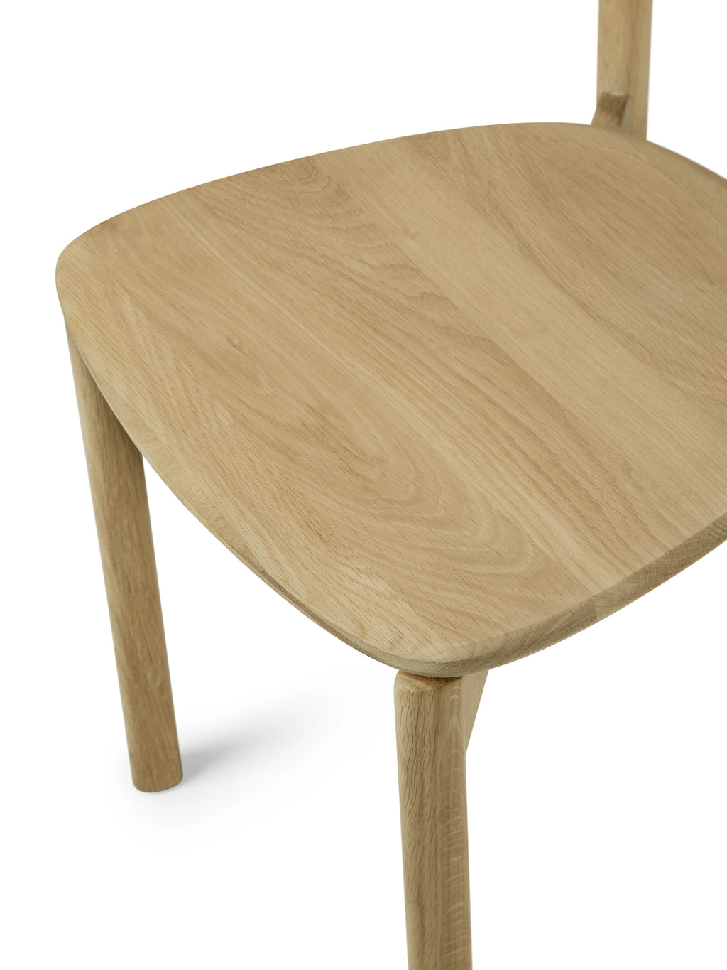Ethnicraft Risu Dining Chair, a modern minimalist dining chair crafted from light natural solid oak wood with a smoothly curved seat and backrest, featuring clean lines and sturdy cylindrical legs. This Scandinavian-inspired oak chair is perfect for contemporary dining rooms, kitchen areas, or as a stylish accent chair in organic modern interiors.