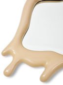 Beige antler-like object on a white background