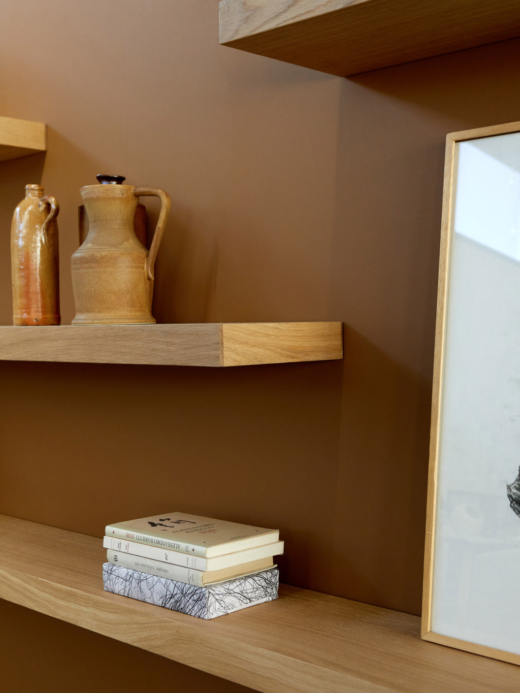 Ethnicraft Wall Shelf, a minimalist solid oak floating shelf featuring a clean, rectangular profile and a natural light wood grain finish. This contemporary oak shelf provides versatile display space with an organic modern aesthetic, perfect for Scandinavian living rooms, bedrooms, or home office shelf styling.