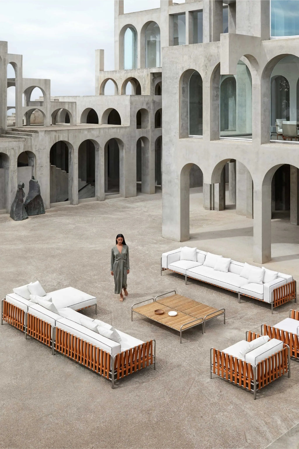 Gandia Blasco Onsen Coffee Table 153, a rectangular modern minimalist outdoor coffee table crafted with a natural, light brown slatted teak wood top and a sleek, durable matte.