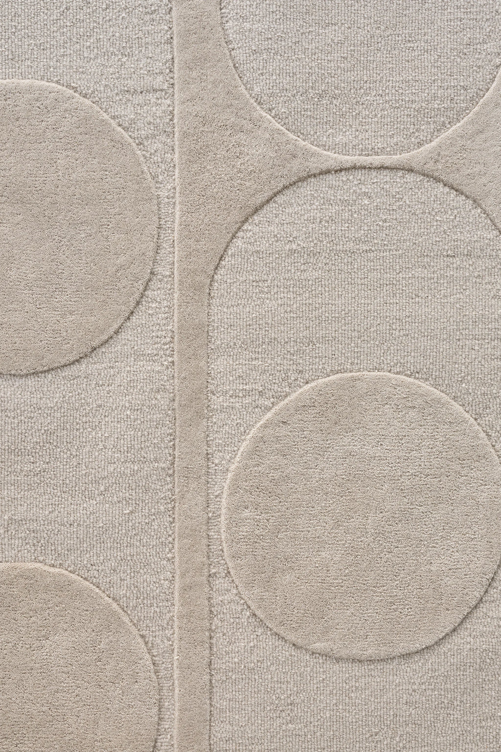 Linie Design Orb Alliance Wool Rug, a contemporary area rug crafted from hand-tufted wool in a soft, natural beige hue with a sculptural, high-low pile.
