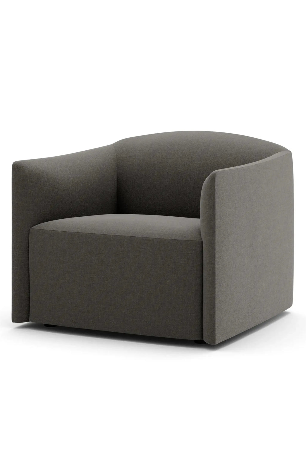 New Works Shore Lounge Chair - Extended Base, a modern dark grey upholstered lounge chair featuring a subtly textured fabric, a gracefully curved backrest and armrests, and a substantial extended base for a grounded, minimalist aesthetic. This contemporary armchair is perfect for a stylish living room, a cozy reading nook, or as a sophisticated bedroom accent.