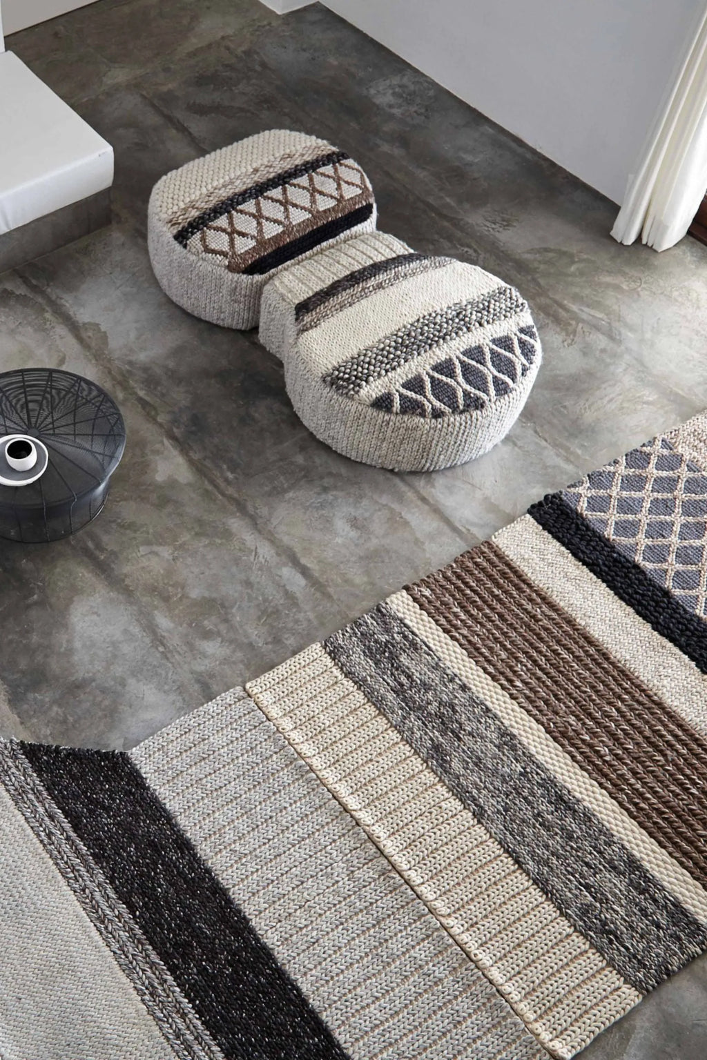 GAN Rugs Mangas Original Rectangular Rug, a premium hand-knitted wool area rug featuring a richly textured, striped design in natural undyed cream, beige, brown, and charcoal tones.