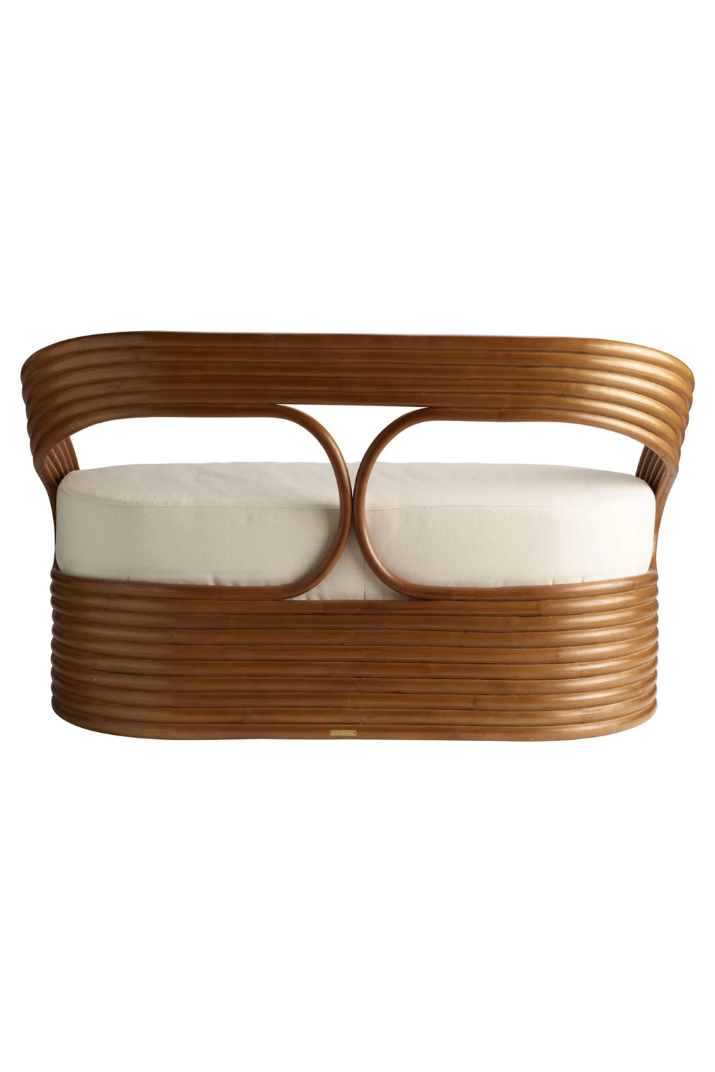 Tine K Mano Sofa, a distinctive organic modern sofa crafted from warm natural bent rattan with a unique looped backrest design and a rounded base. It features plush, removable cream-colored fabric cushions, offering a comfortable and stylish seating solution. Perfect as a coastal living room sofa, boho entryway bench, or a tropical-inspired accent for sunrooms and bedrooms.