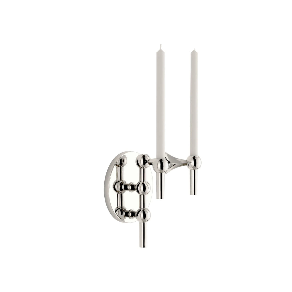 Stoff Nagel Wall Hanger Candle Holder - Chrome - Configuration 1, a polished chrome metal wall-mounted candle holder featuring a modular design with spherical joints and cylindrical rods, holding two elegant white taper candles.