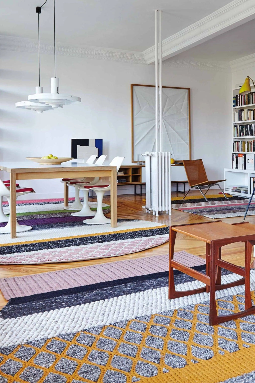 GAN Rugs Mangas Original Rectangular Rug, a vibrant hand-knotted wool area rug featuring a playful patchwork of multi-color stripes and varied textures, including chunky knits and intricate patterns in shades of pink, purple, green, yellow, black, white, grey, and orange. This contemporary designer rug adds a bold, eclectic statement to modern living rooms, dining spaces, or creative interiors.