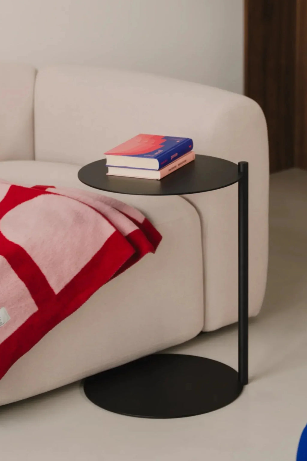 noo.ma Flom 2-Seater Sofa, a compact modern minimalist sofa upholstered in a soft, textured cream fabric, featuring a gently curved organic profile, plush deep seating, and clean Scandinavian.