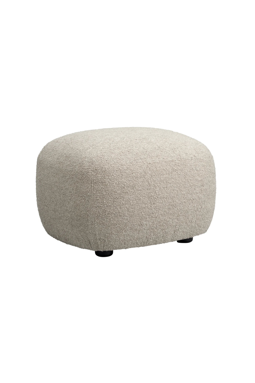 NORR11 Little Big Pouf, a contemporary organic modern pouf upholstered in a plush, textured light beige bouclé fabric, featuring a soft, rounded pill shape and subtle seam detailing. This versatile and cozy accent piece is ideal as an ottoman or extra seating for a Scandinavian living room, minimalist bedroom, or comfortable reading nook.