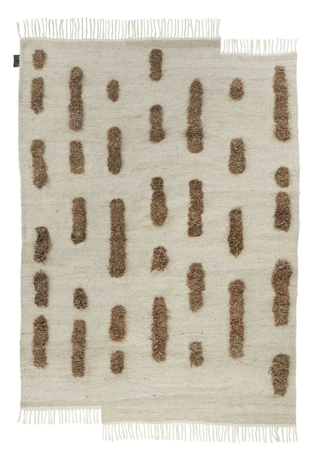 Sera Helsinki Laine Rug, a hand-knotted natural wool area rug featuring a cream flat-weave base with scattered organic brown shaggy pile accents and fringed edges.
