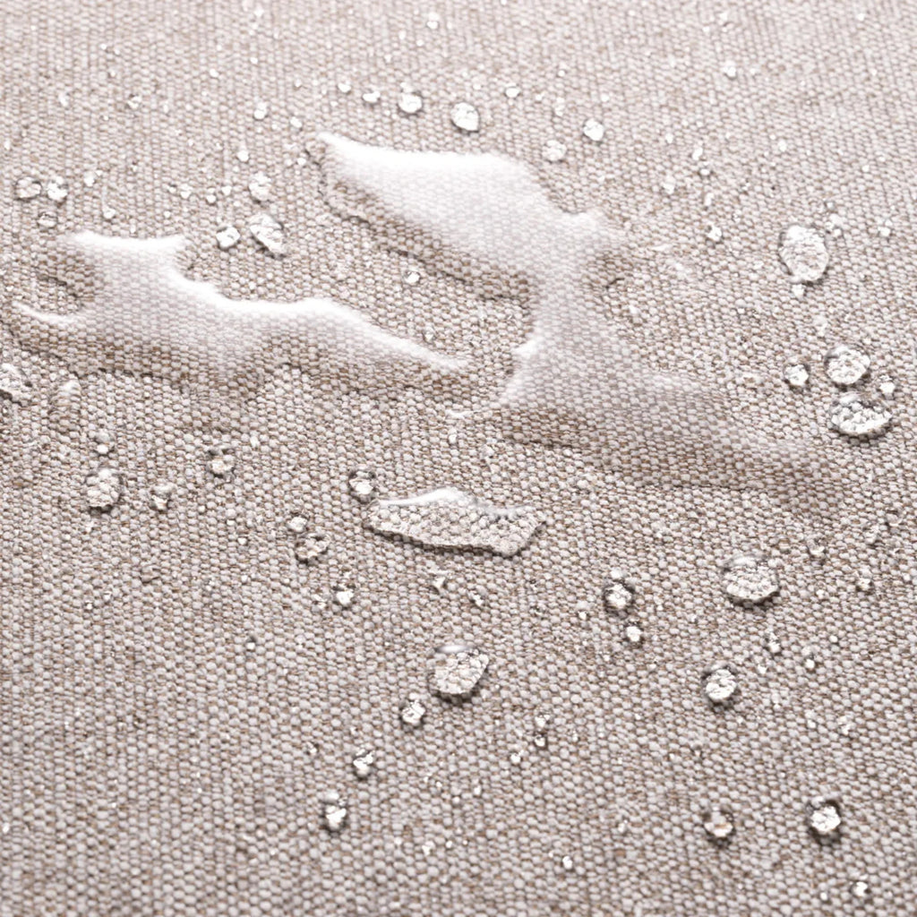Eichholtz Residenza Outdoor Sofa, showcasing its durable, weather-resistant outdoor upholstery fabric. This tightly woven, light beige performance fabric features a subtle flecked texture, with water droplets beading on its surface to highlight its waterproof and stain-resistant qualities. Perfect for luxurious and practical outdoor living room furniture, ensuring longevity and easy maintenance.