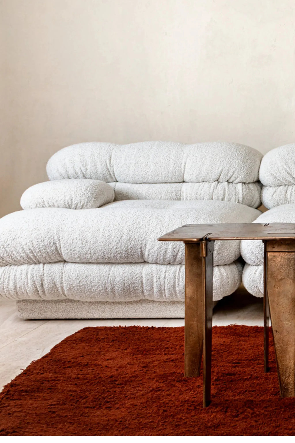Hessentia Lowell Modular Sofa, a luxurious off-white bouclé sofa with a distinctive pillowy, cloud-like silhouette and soft, highly textured fabric.
