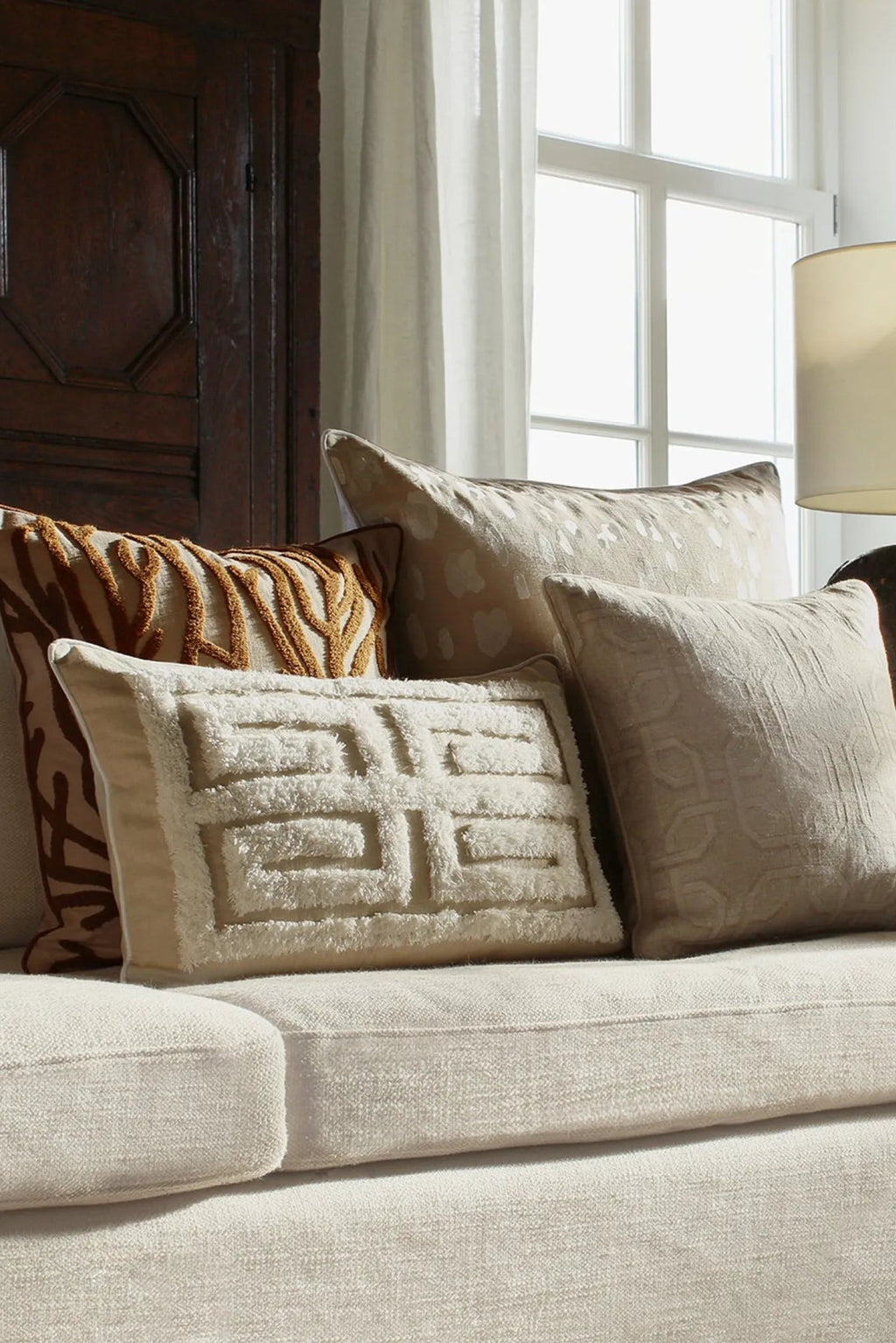 Cleo Cushion with a stylish fringe detail in a versatile cream color