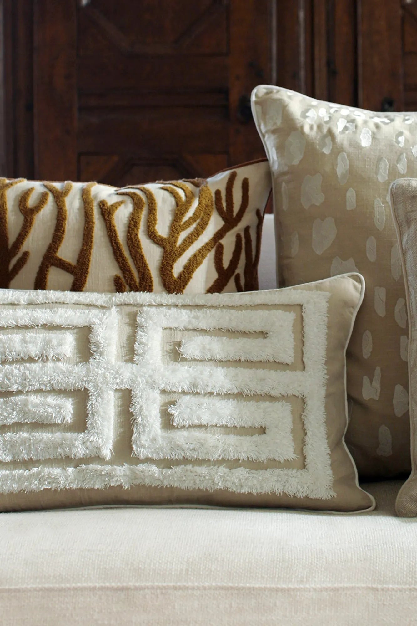 Beautiful Cleo Cushion Cover with intricate embroidered details and soft, luxurious fabric in a neutral color palette, perfect for adding elegant style to any room