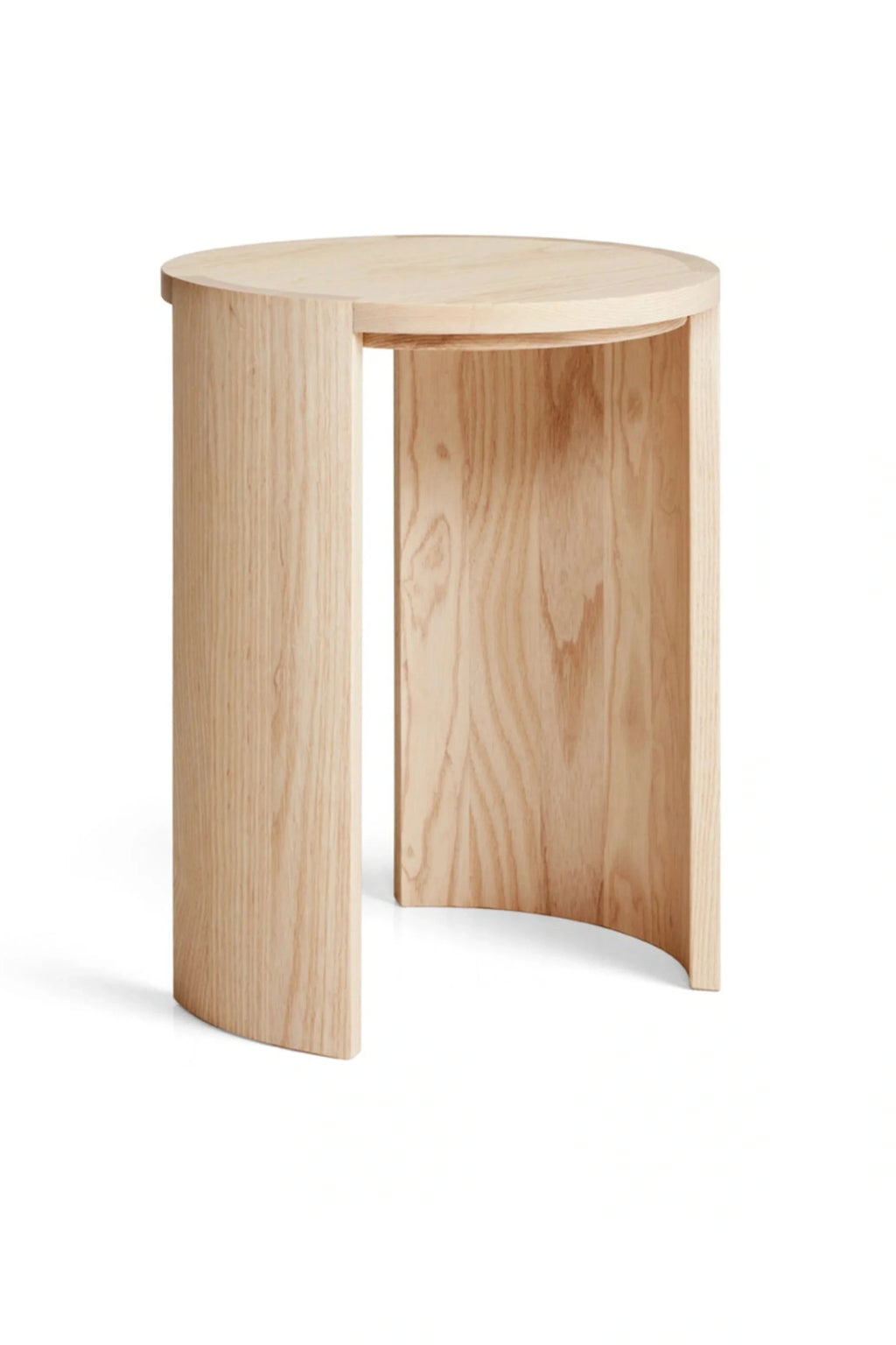 Made by Choice Airisto Side Table, a modern minimalist side table crafted from light ash wood with a smooth, natural grain and a pale blonde finish. Its distinctive cylindrical top rests on two curved, thick legs, creating an open, architectural form. This Scandinavian-inspired accent table is perfect as a contemporary bedside table or a minimalist living room end table.