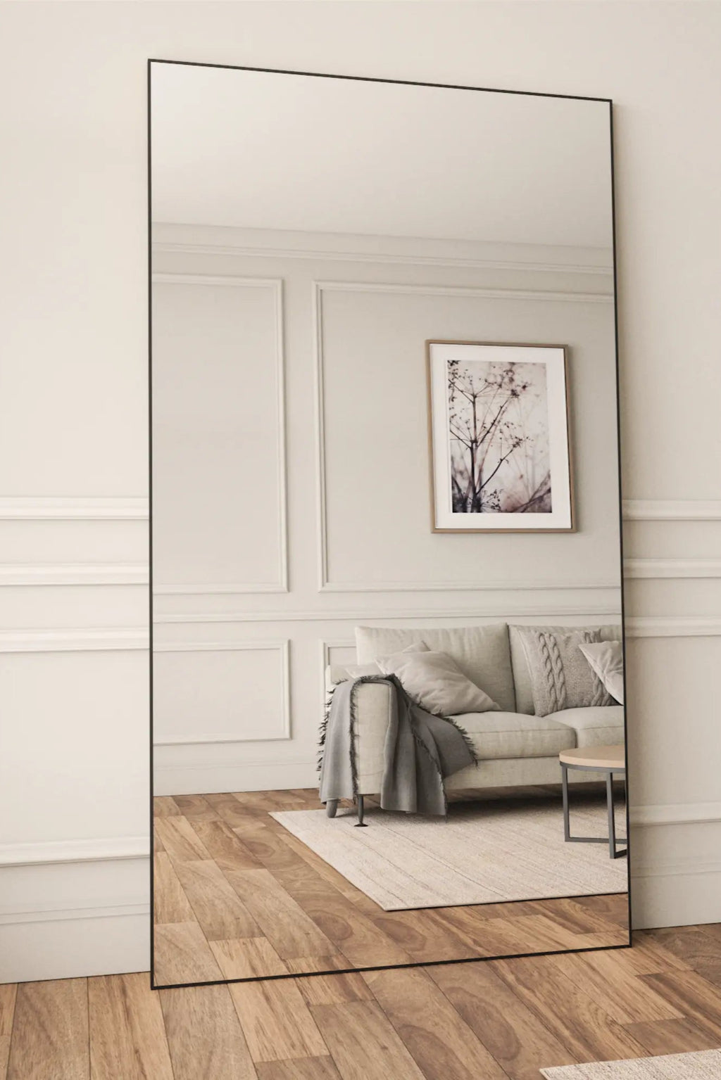 TCL Studios Sleek Full Length Mirror, a tall rectangular floor mirror featuring an ultra-thin matte black metal frame that offers a contemporary minimalist aesthetic. This full-length mirror is perfect for creating an illusion of space and adding a modern touch to any bedroom, living room, or entryway.