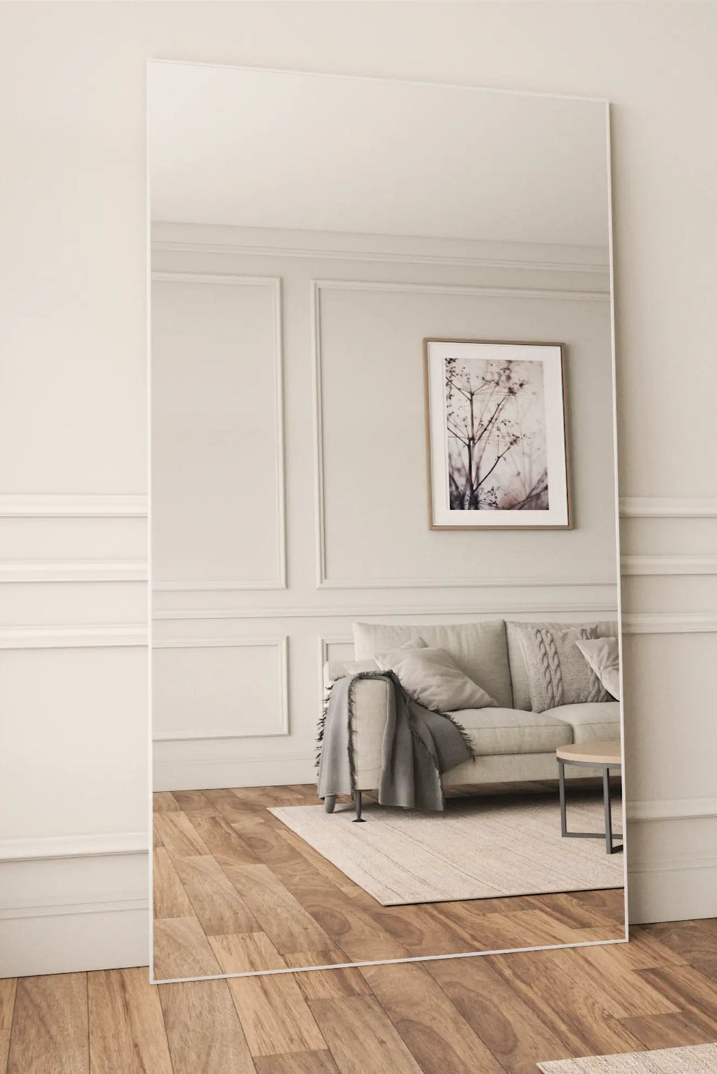 TCL Studios Sleek Full Length Mirror, a tall frameless rectangular mirror featuring a modern minimalist design with a clean, reflective glass surface. This contemporary leaning floor mirror is perfect for adding light and depth to a Scandinavian-inspired living room, bedroom, or entryway dressing area.