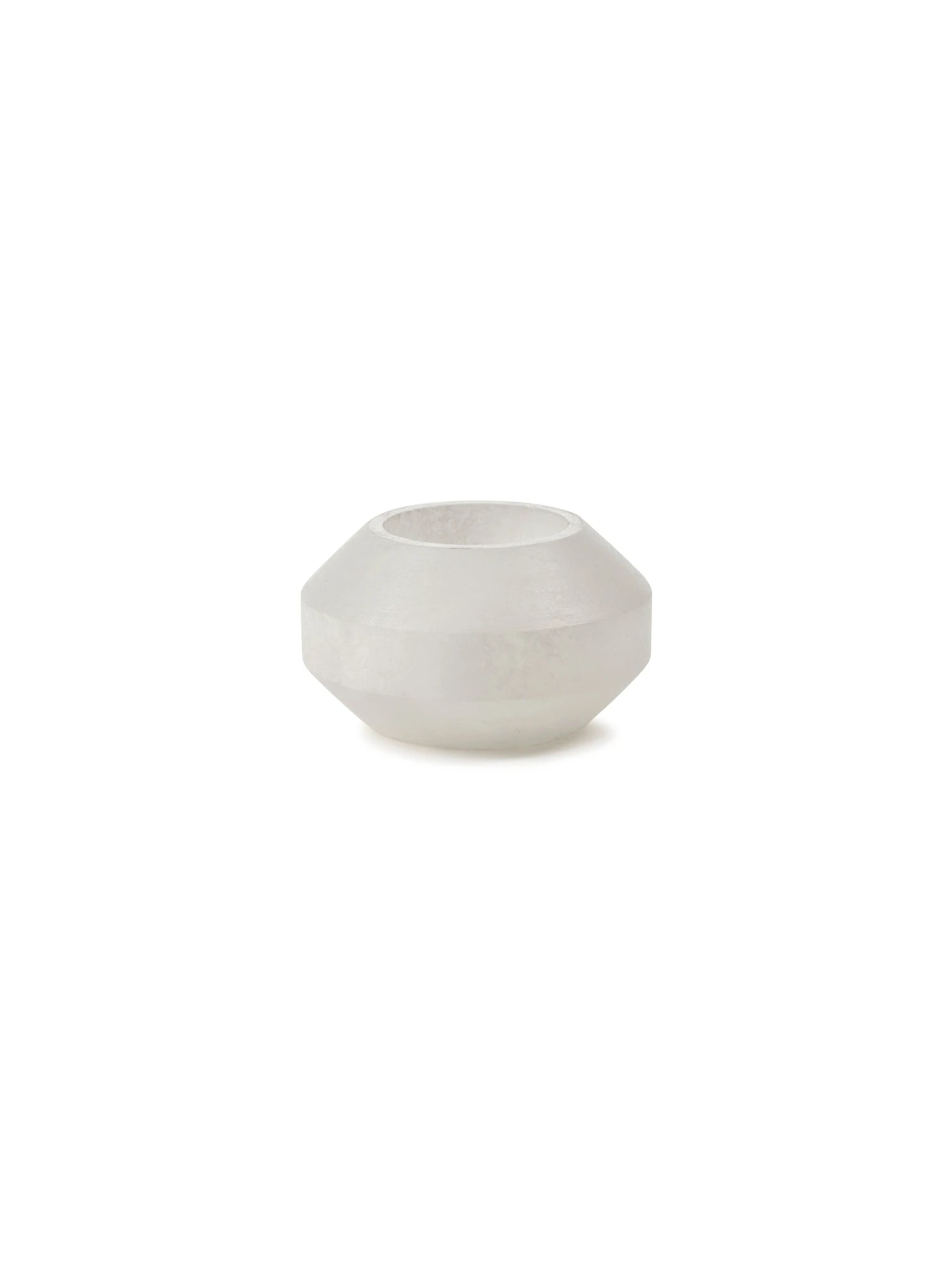 Small white alabaster candle holder on a white background