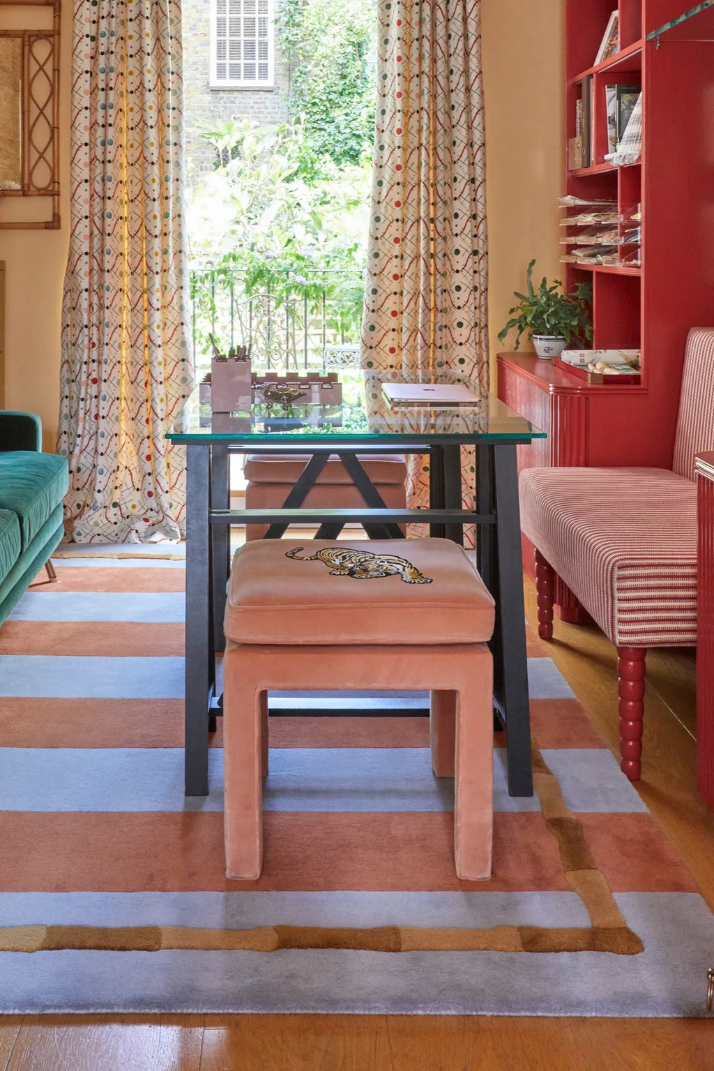 Layered Bamboo Stripe Wool Rug, a vibrant modern area rug featuring wide horizontal stripes in rust orange and light blue, with a unique sculptural bamboo-like border in varying shades of brown. Pe...