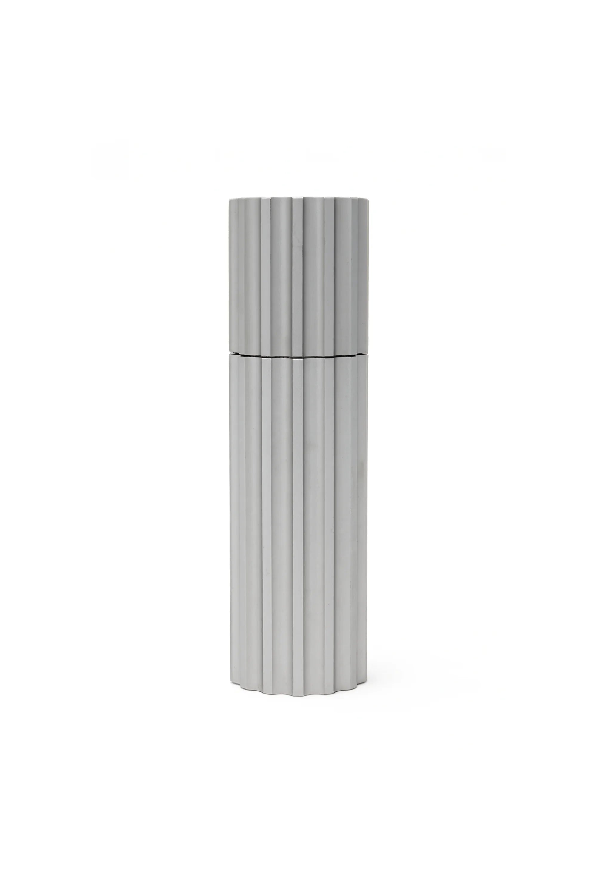 Tall cylindrical container with ribbed design on a white background