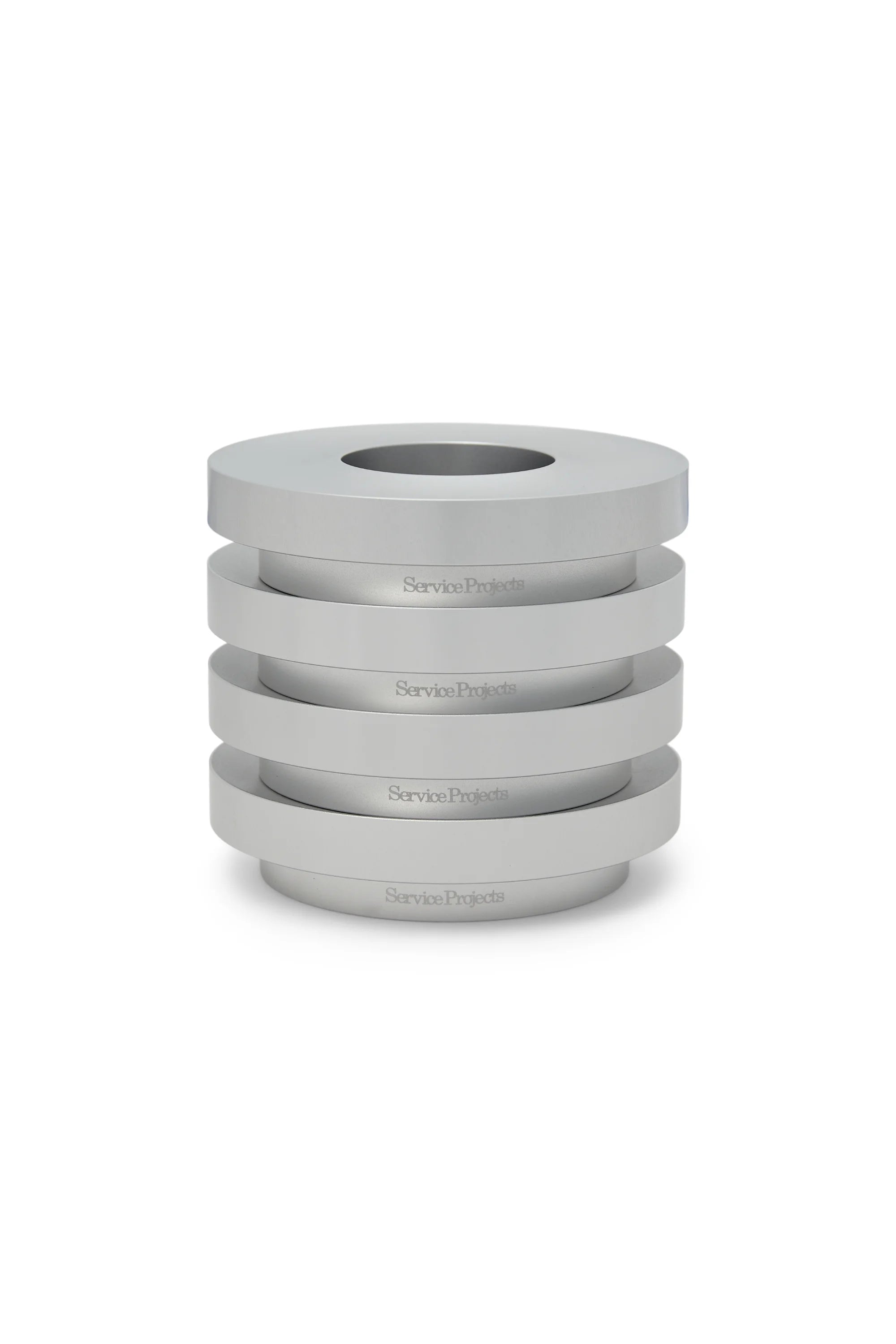 Set of gray steel egg cups stacked on a white background