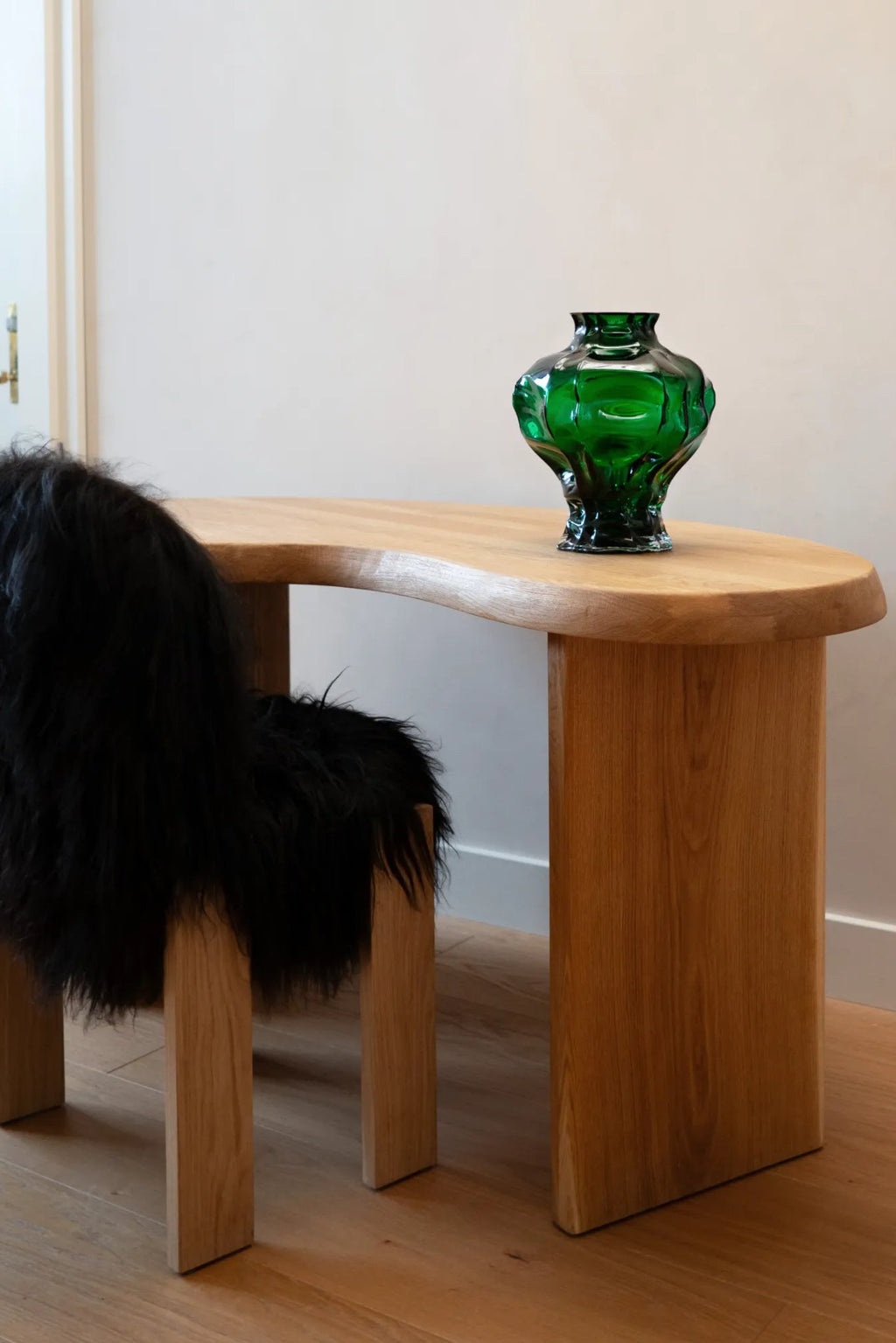 Handcrafted ceramic Ammonit Vase with intricate spiral design and earthy tones