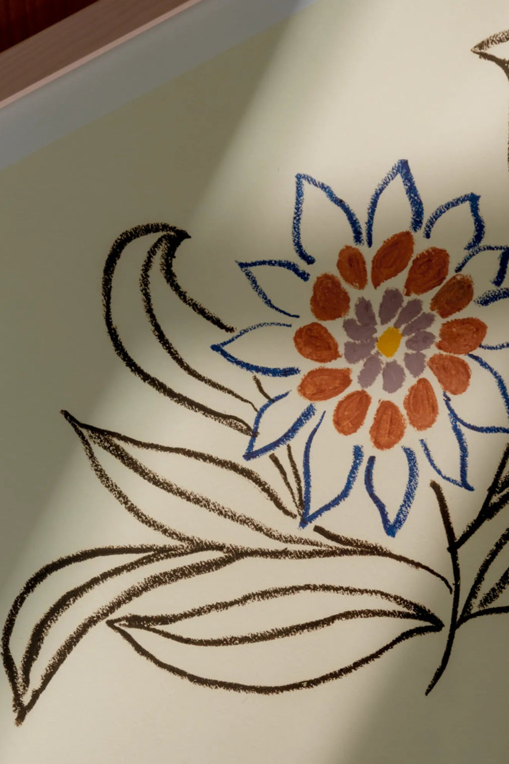 The Poster Club Nectar, an abstract floral art print featuring a stylized hand-drawn flower with a textured, crayon-like finish on a warm cream background. It showcases dark brown stems and leaves, royal blue outer petals, terracotta orange middle petals, and a lavender purple center with a yellow stamen. This contemporary and organic modern wall art is perfect for boho living rooms, bedrooms, or eclectic gallery walls.