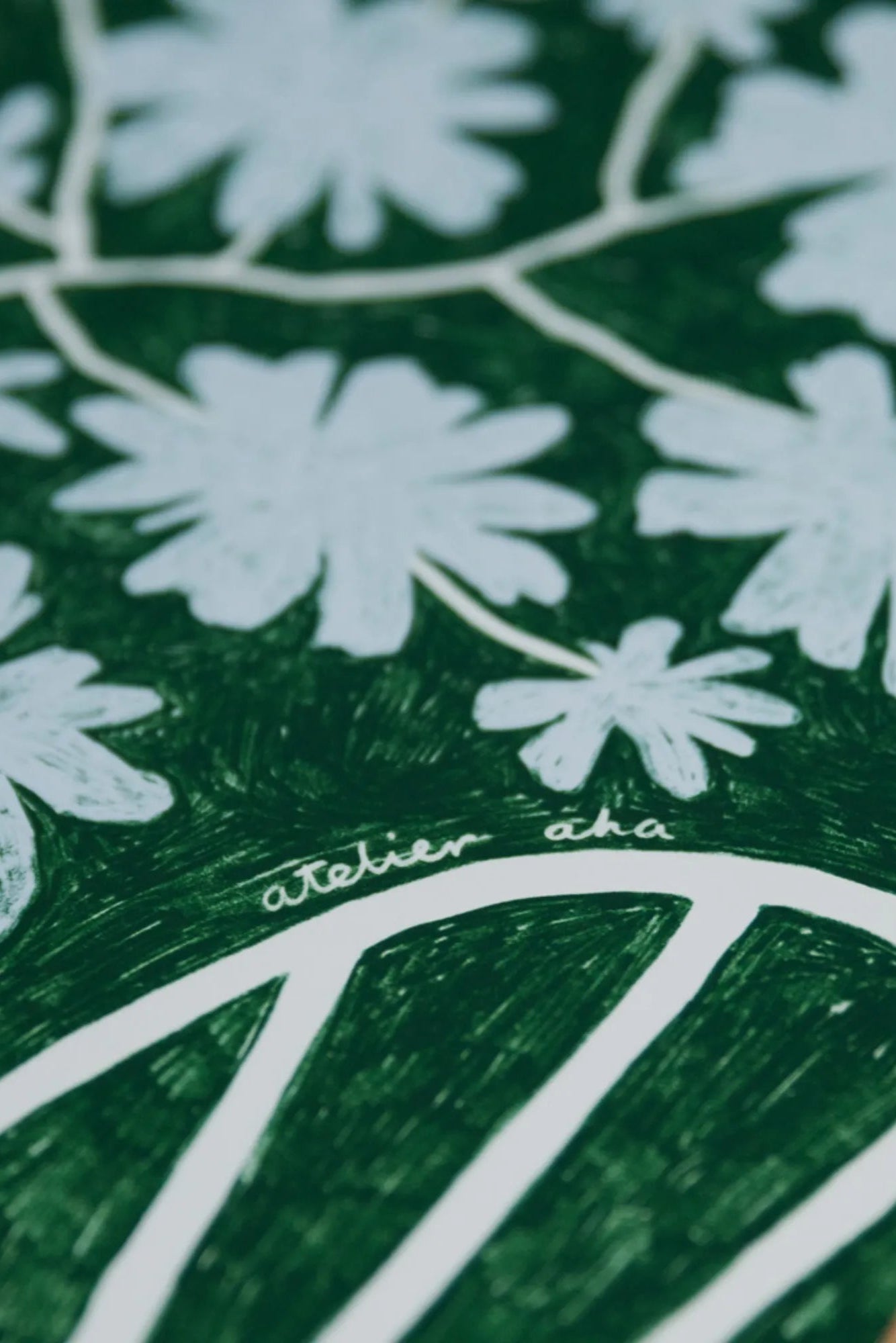 Beautiful bouquet of fresh blue flowers arranged in a glass vase with a bottle of rich red wine on a wooden table, perfect for a romantic evening