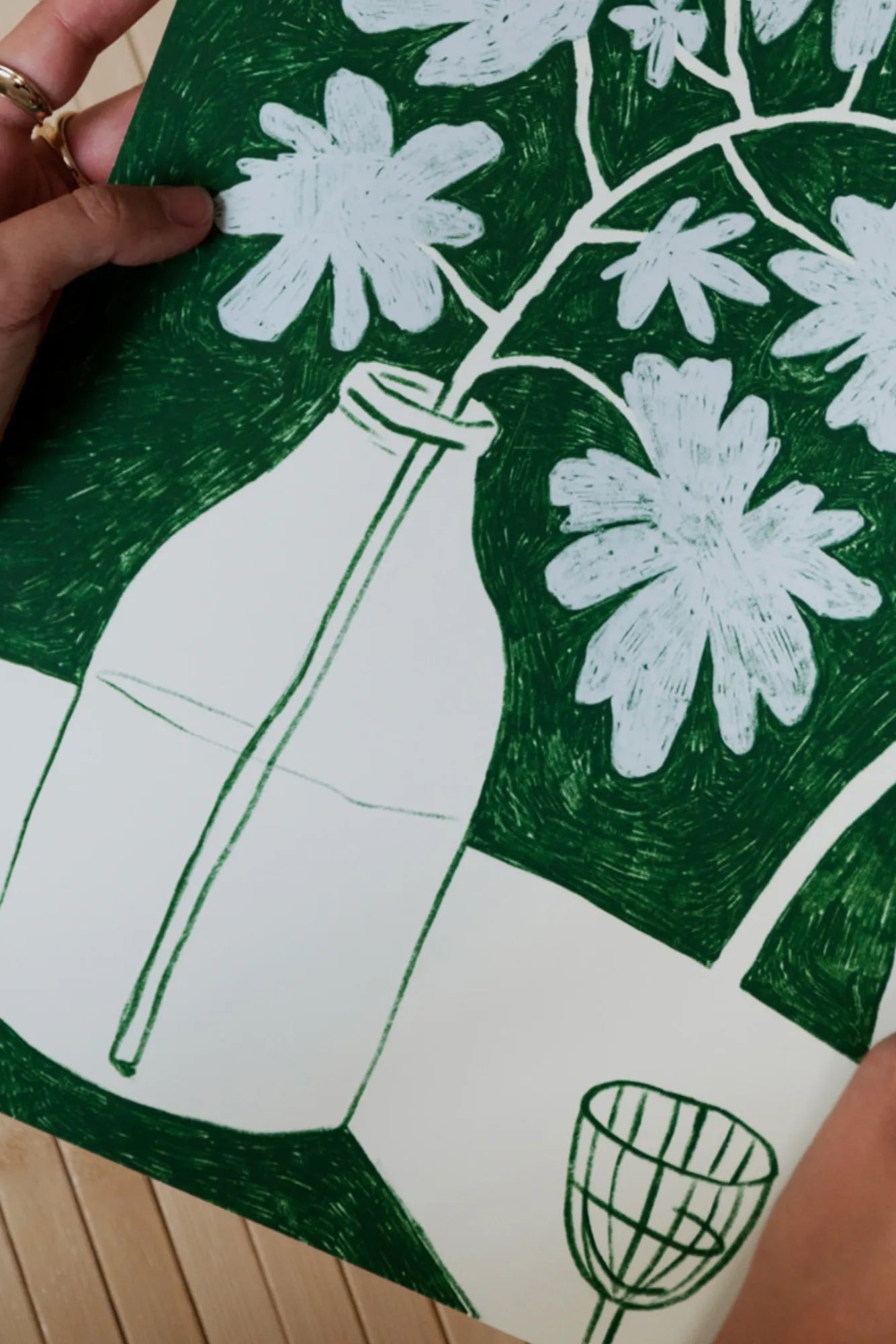 Beautiful blue flowers and a bottle of delicious red wine on a table setting for a romantic evening