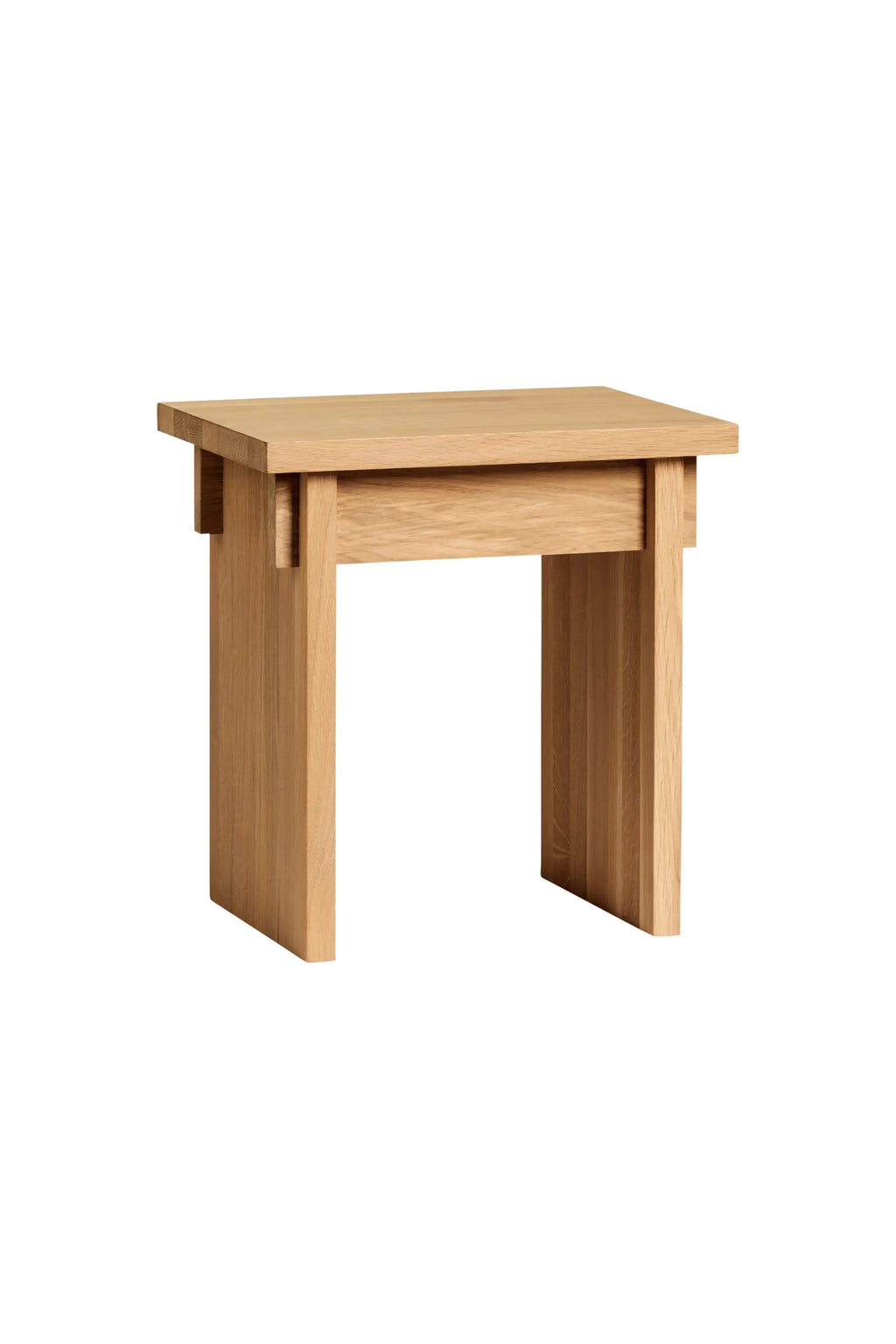 Kristina Dam Artisan Stool, a modern minimalist solid oak stool crafted from natural light oak wood, featuring a sturdy blocky silhouette and visible wood grain. Its clean, architectural lines and thick square top embody an organic modern aesthetic. Perfect as a versatile solid wood side table, accent stool, or bedside table for Scandinavian, Japandi, or contemporary interiors.