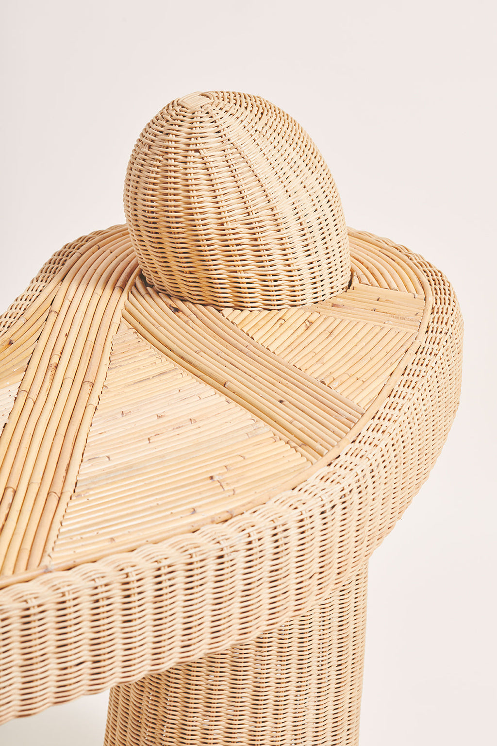 Heaps & Woods Asahan Desk, a natural light beige hand-woven rattan desk showcasing a curved organic silhouette with a distinctive rounded dome backrest and a geometric pattern crafted from smooth rattan cane on its desktop.