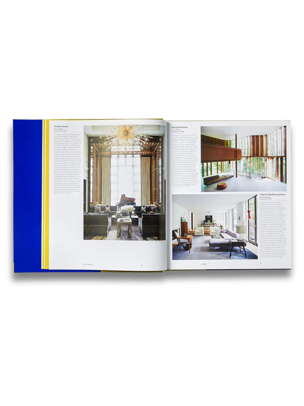 Book Atlas of Interior Design, an open hardcover book featuring vibrant blue and yellow binding, showcasing detailed interior photography and text. This essential design book is perfect for interior design enthusiasts, students, and professionals seeking modern inspiration and architectural insights.