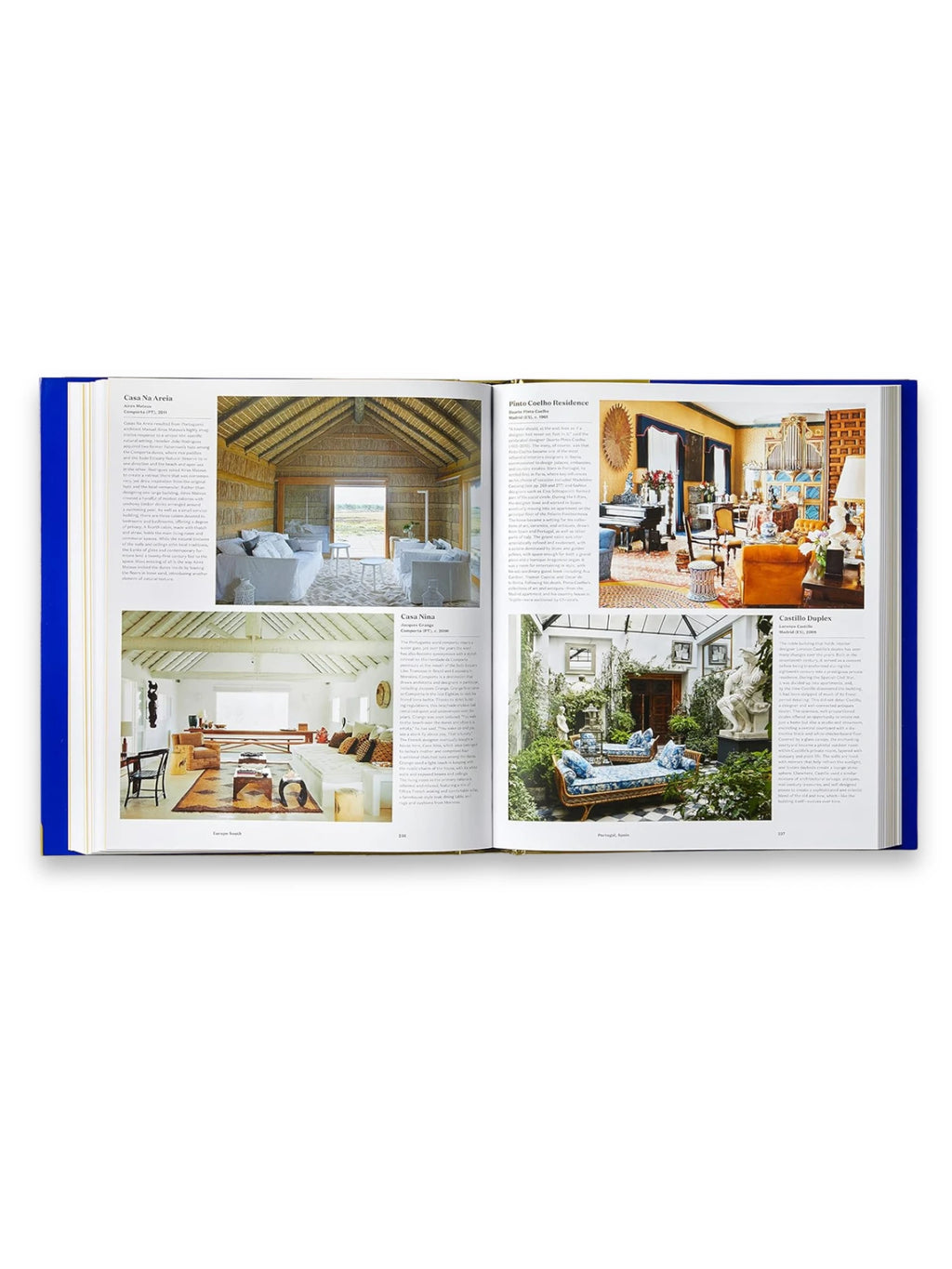 Book Atlas of Interior Design, an open, hardcover book with a vibrant royal blue binding, showcasing glossy pages filled with diverse interior design photographs and descriptive text. This comprehensive design book is perfect for interior design enthusiasts and professionals seeking inspiration.