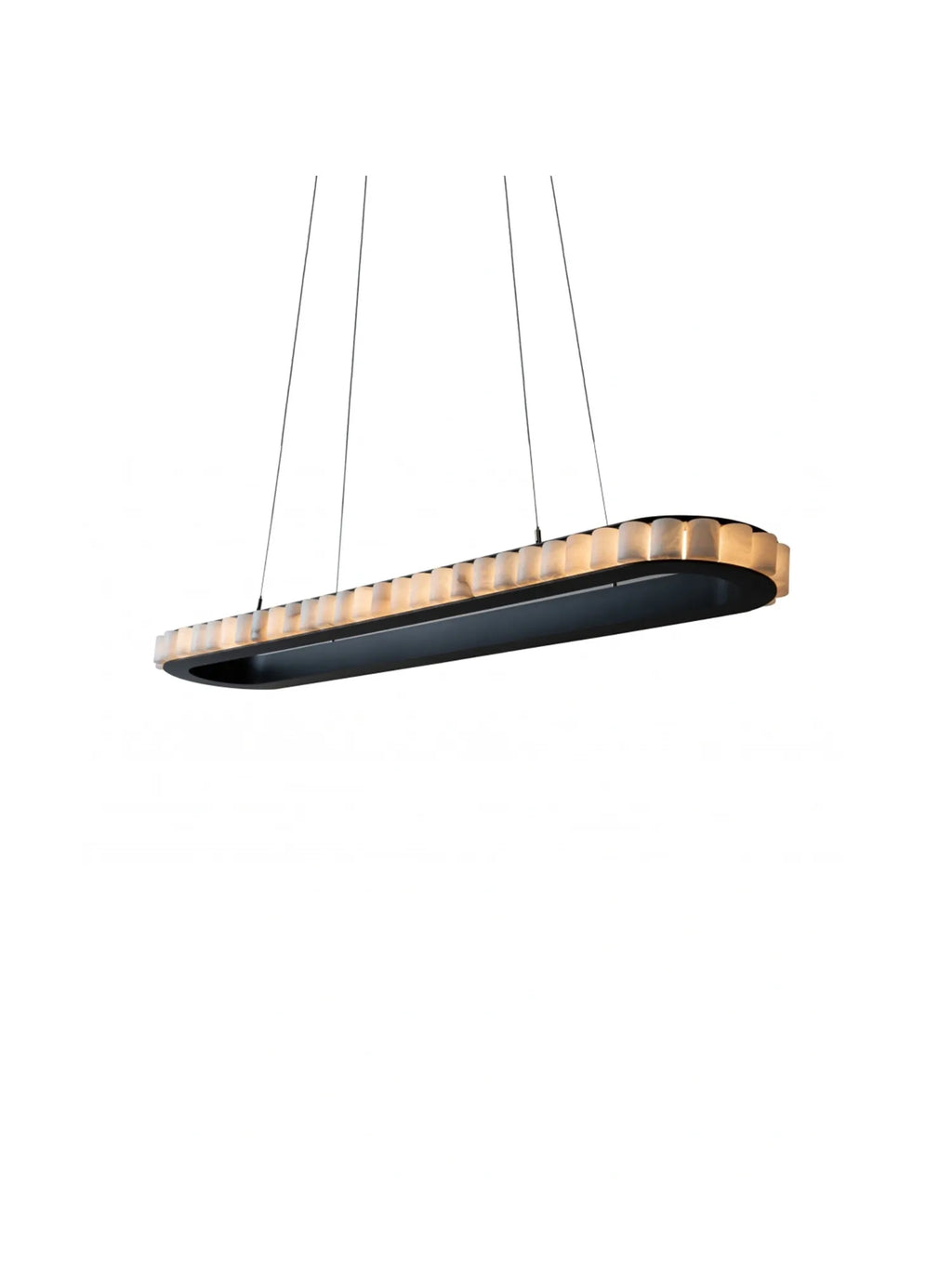 CTO Lighting Avalon Oval Pendant Light, a sleek, elongated oval linear pendant light featuring a matte black metal frame and numerous ridged alabaster diffusers that emit a warm, ambient glow. This contemporary designer ceiling light offers a sophisticated Art Deco aesthetic, perfect for modern dining rooms, kitchen islands, or luxury living spaces.