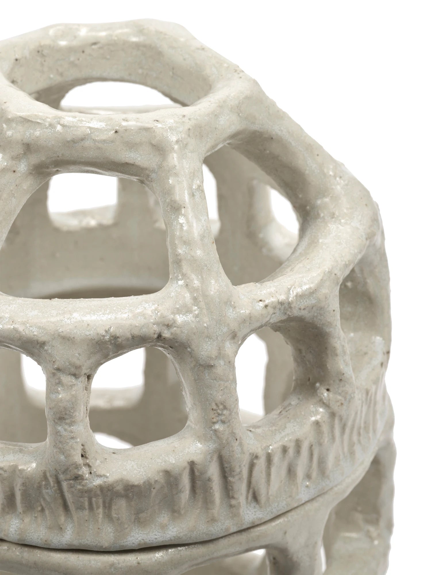 Ceramic lantern with geometric design on a white background